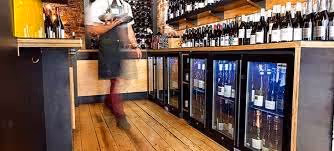 display fridge behind restaurant bar. Restaurant equipment.